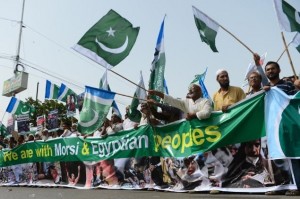 Pakistani Islamists march to protest the miltary coup.  The stakes are getting higher all the time. 
