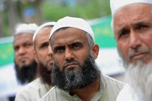 Pakistani Islamists listen to news of military repression in Egypt. The world is watching.