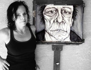 Kim Nicolini and her portrait of Lou Reed.