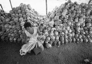 Relative of the massacre sooting out skulls. 