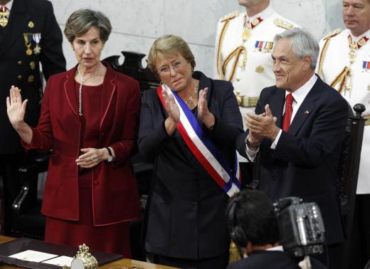 Chile's President Michelle Bachelet (C), Senate President Isabel Allende (L), and outgoing President Sebastian Pinera applaud after Bachelet was sworn in to office in Valparaiso, March 11, 2014. CREDIT: REUTERS/MAGLIO PEREZ