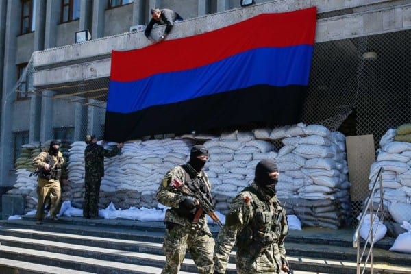 Donetsk Republic Flag hangs from sepaatist-controlled building.