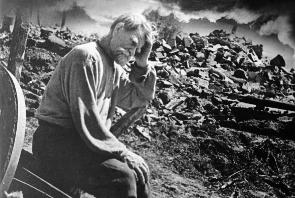 The Ukraine was hit exceptionally hard by the German onslaught.  Here, in 1941, a bewildered old man sits in the ruins of his village - attacked and destroyed by the German army.