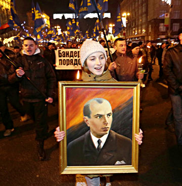 During the Maidan protests, a Jan. 1, 2014 torchlight march in Kiev was held to honor Ukraine's WWII era ultranationalist, Stepan Bandera (1909-1959). 15,000 extremists carried Svoboda party banners and the red and black battle flag of Bandera's paramilitary, the Ukrainian Insurgent Army. (AP Photo by Efrem Lukatsky).