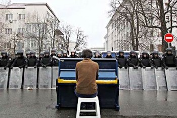 Chopin Performance. 2013. Mariyan Mitsik. As mentioned in the ARTnews article "Icons on the Barricades," Mitsik performed in the streets at a piano painted in the colors of the Ukrainian flag.