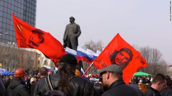 Demonstrators wave revolutionary flags at a major pro-Russia rally in Lenin Square in central Donetsk. The Donbass is a completely different Ukraine.