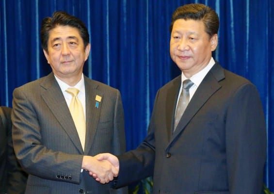 Japan's PM Abe and China's President Xi Jinping do the obligatory handshake at the APEC Conference. Abe is an out and out reactionary happy to implement US warmongering policies in the region. 