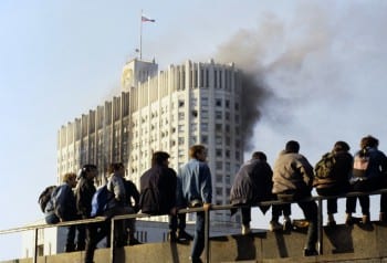 Muscovites watch the Parliament building being shelled (1993). 