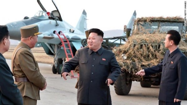 Kim Jong-Un (C) inspects a flight drill by the Korean People's Army (KPA) Air and Anti-Air Force, at which units 1017, 447 and 458 of the KPA took part, at undisclosed location in North 