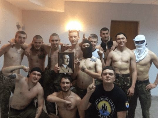 Kids from Kiev's Azov Battalion pose with Hitler's portrait.  (FortRuss.com)