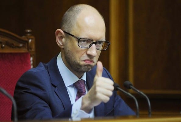 This handout picture taken and received by the Prime Minister press service on August 14, 2014 shows Ukrainian Prime Minister Arseniy Yatsenyuk making the thumbs up after voting at the Parliament during a session. Ukraine's Parliament on August 14 approved a law paving the way for a string of sanctions on Russian businesses and nationals accused of backing a separatist uprising in the east of the country. Kiev has drawn up a sanctions list of 65 mainly Russian companies and 172 individuals and the new law now gives Ukraine's National Security and Defence Council -- headed by the president -- the right to impose the punitive measures. AFP PHOTO/ PRIME MINISTER PRESS SERVICE/ ANDREW KRAVCHENKO -- RESTRICTED TO EDITORIAL USE- MANDATORY CREDIT "AFP PHOTO /PRIME MINISTER PRESS SERVICE / ANDREW KRAVCHENKO" - NO MARKETING - NO ADVERTISING CAMPAIGNS - DISTRIBUTED AS A SERVICE TO CLIENTS --