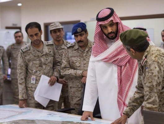 The Saudi Mafia at work: Defense Minister, Prince Mohammad bin Salman bin Abdulaziz al-Saud (2 - R), being debriefed at the headquarters responsible for coordinating airstrikes on Yemen. 