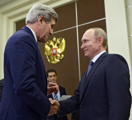 U.S. Secretary of State John Kerry, left, shakes hands with Russian President Vladimir Putin at the Bocharov Ruchei residence in Sochi, Russia, Tuesday May 12, 2015. (Alexei Nikolsky/RIA-Novosti, Kremlin Pool Photo via AP)