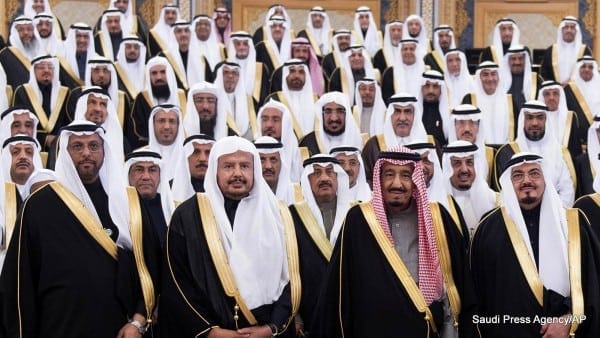 FILE - In this Tuesday, Jan. 6, 2015, file mage released by Saudi Press Agency, SPA, Saudi Arabia's Crown Prince Salman bin Abdulaziz Al Saud, 2nd right first row, poses with Shura members at consultative Shura Council in Riyadh, Saudi Arabia. Saudi Arabia's new monarch isn't wasting time. Since assuming the throne Jan. 23, King Salman has elevated some of his closest relatives and sidelined previous power-brokers, tightened decision-making and promised lavish payouts designed to win early goodwill. (AP Photo/Saudi Press Agency, File)