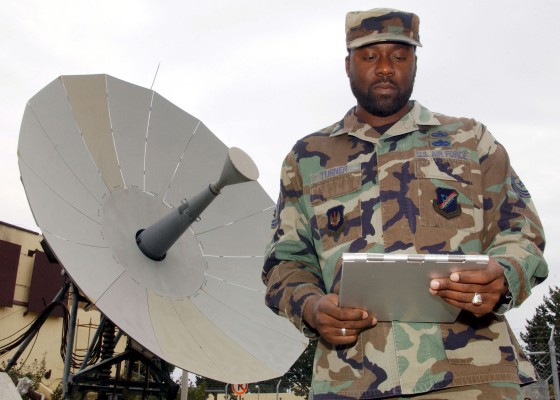 INCIRLIK AIR BASE, Turkey -- Tech. Sgt. Glynis Turner inspects satellite communications equipment here. During his free time, he is the Islamic lay leader for the base chapel which welcomes all religions. Turner is a quality assurance evaluator with the 39th Communications Squadron. (U.S. Air Force photo by Airman 1st Class Joseph Thompson)