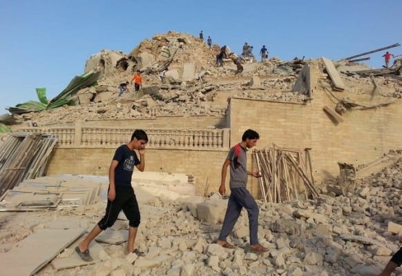 epa04329143 Iraqis inspect the wreckage of the grave of the Nebi Yunus, or prophet Jonah, in Mosul, northern Iraq, 24 July 2014. Allegedly, members of jihadist Islamic State of Iraq and Syria (ISIS), which now goes by the name the Islamic State (IS), have demolished the historic grave of the Nebi Yunus, the biblical prohet Jonah in the east of Mosul. EPA/STR